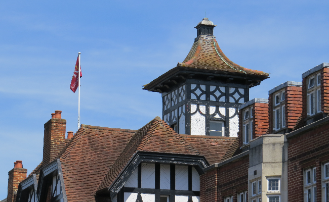 An old building in Twickenham, with white painted walls and black painted wooden beams.